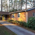 Front of one story brick house