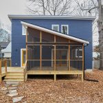 Exterior of blue two story ADU with screen porch